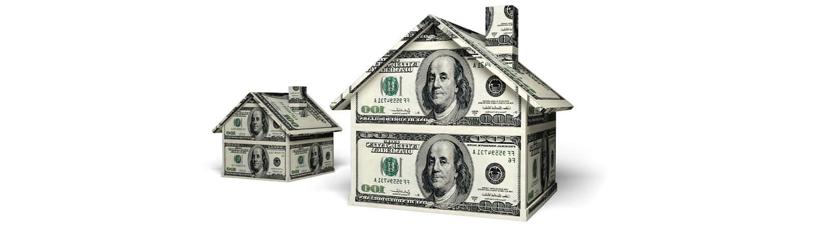 Two house models made of one-hundred-dollar bills are shown. The larger house is in the foreground, symbolizing wealth and real estate.